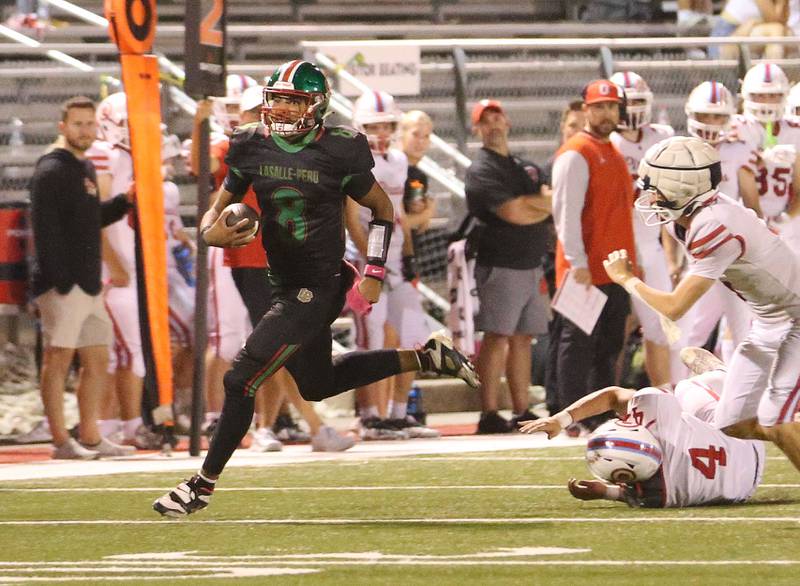 L-P's Marion Persich sprints down the field as Ottawa's Logan Mills falls to the turf on Friday, Oct. 3, 2025 at Howard Fellows Stadium.