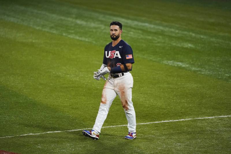 United States' Eddy Alvarez walks to the dugout after grounding out in the fifth inning of the gold medal baseball game against Japan at the 2020 Summer Olympics, Saturday, Aug. 7, 2021, in Yokohama, Japan.