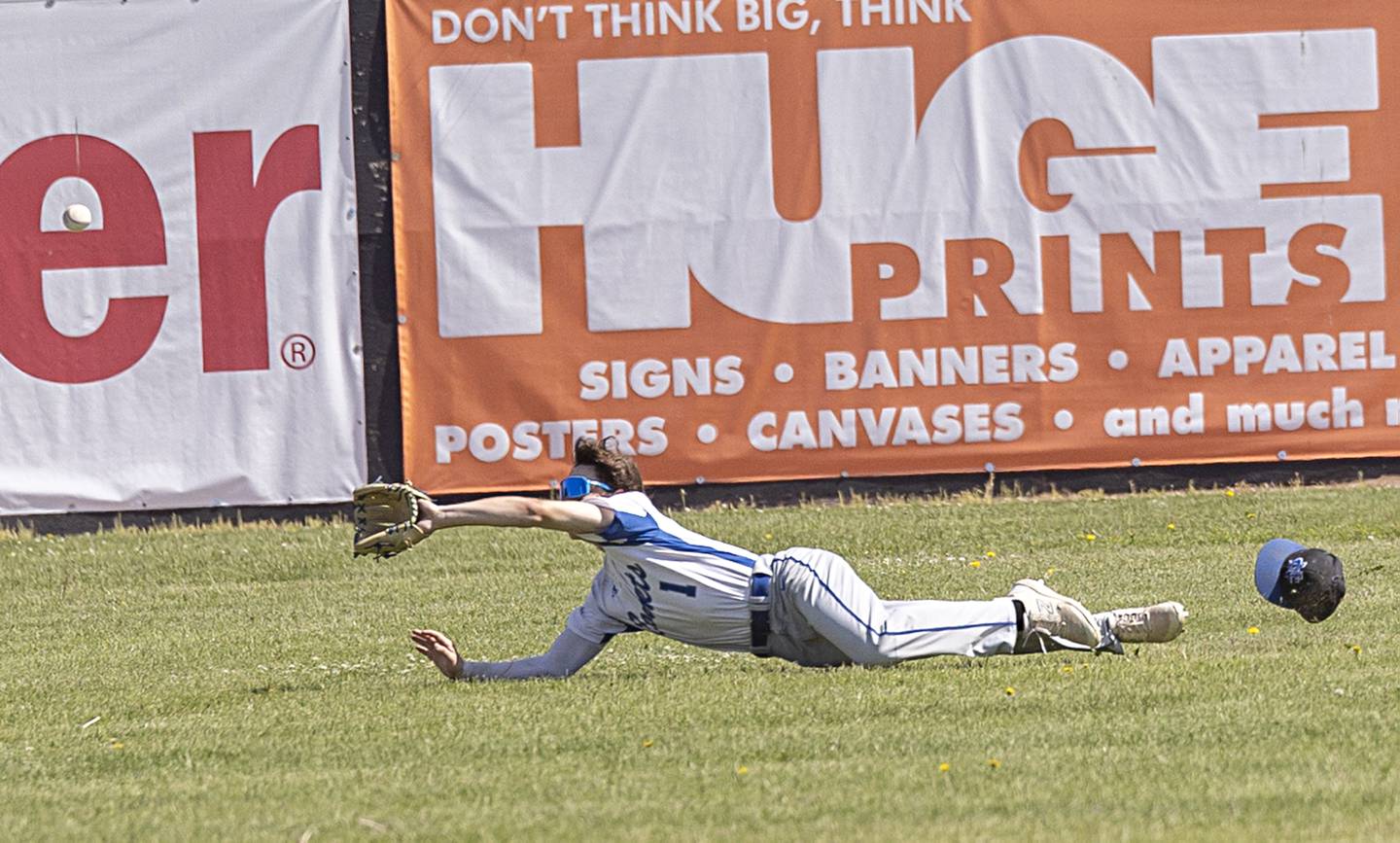 Newman’s Garret Matznick dives but comes up short in a supersectional baseball game against Chicago Hope Monday, May 29, 2023.