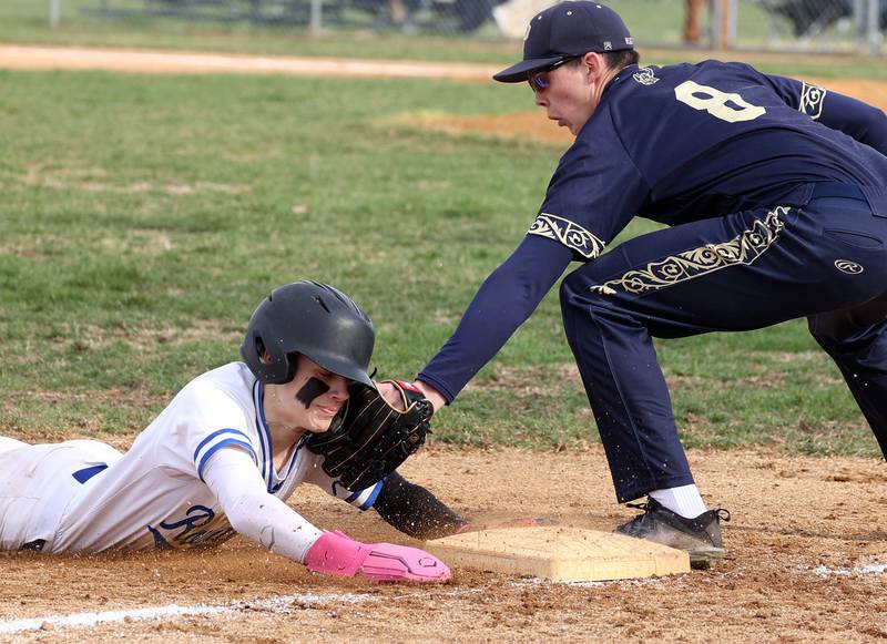 Hinckley-Big Rock’s Skyler Janeski slides in safely with a stolen base ahead of the tag of Polo’s Korbin Cavanaugh during their game Thursday, April 3, 2025, at Hinckley-Big Rock High School.