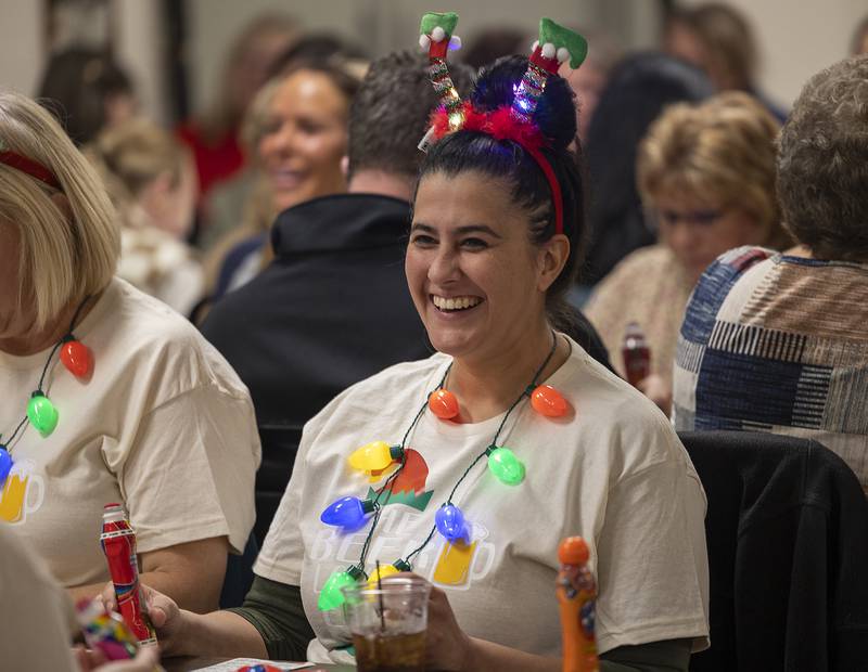 Molly Quick lights up literally and figuratively as she plays bingo with friends Thursday, Nov. 21, 2024, in Rock Falls.