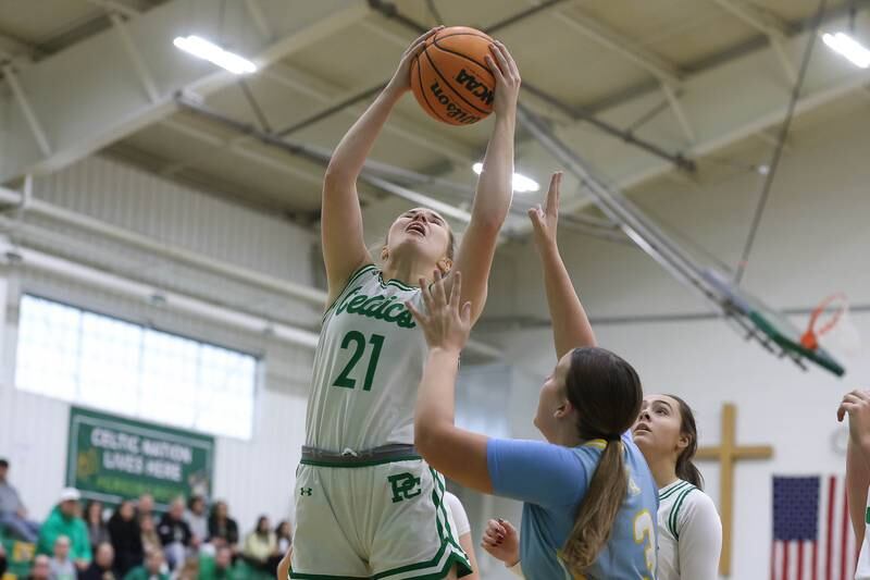 Providence’s Taylor Healy pulls in the rebound against Joliet Catholic on Saturday, Dec. 5, 2025 in New Lenox.