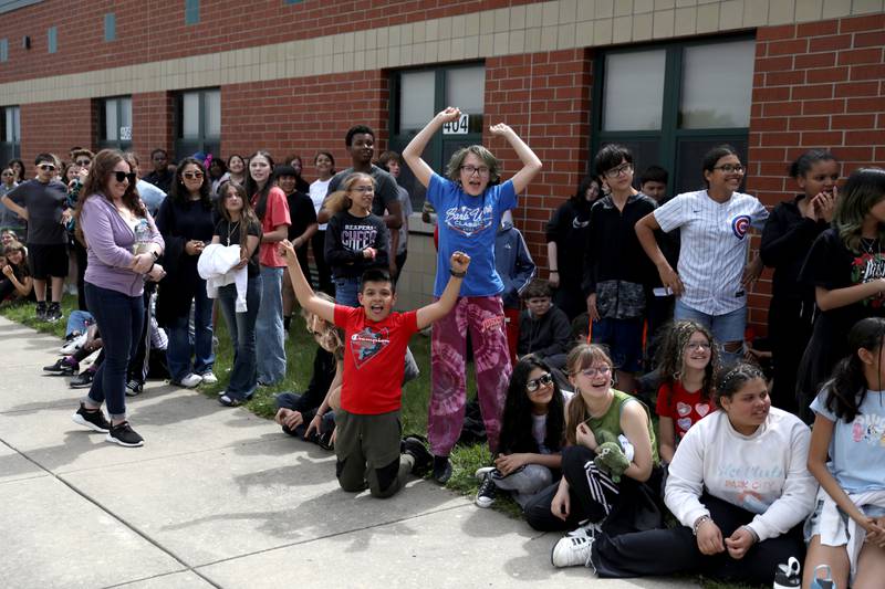 Students cheer as their teachers and staff members surprised them at Emily G Johns Elementary School in Plano with an inflatables race on Tuesday, May 27. 2025 after the all-school field day to celebrate the end of the school year.