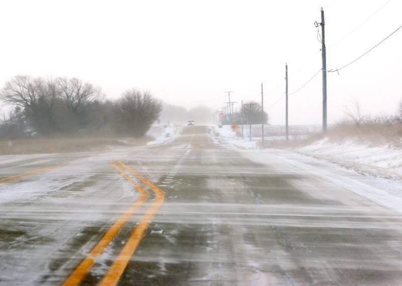 Powdery snow flies across Maple Street Friday morning near Marengo as bitter cold and heavy winds moved in following Thursday snowfall.