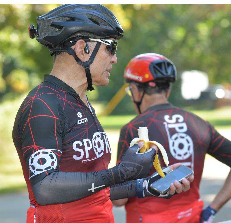 Karl Goetz of Naperville eats a banana during a rest stop at the John Deere Historic Site in Grand Detour during the 10th annual TOSOC (Tour of Scenic Ogle County) on Saturday, Sept. 27, 2025. Goetz was riding with the Spokes bicycling group.