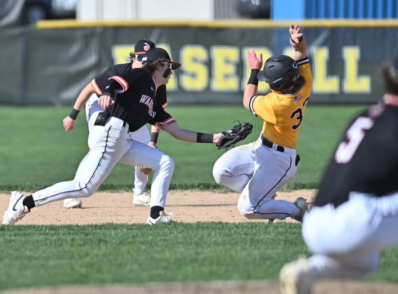 Lincoln-Way West's Kaden Kopacz attempts to tag out Joliet West's Owen Young during the non-conference game on Friday, April. 19, 2024, at Joliet.