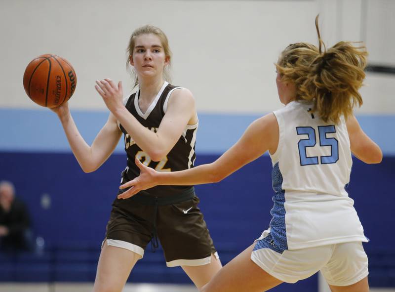 Carmel's Molli Ward (22) looks for an outlet against Nazareth's Amalia Dray (25) during the girls varsity basketball game between Carmel High School and Nazareth Academy on Wednesday, Dec. 7, 2022 in LaGrange, IL.