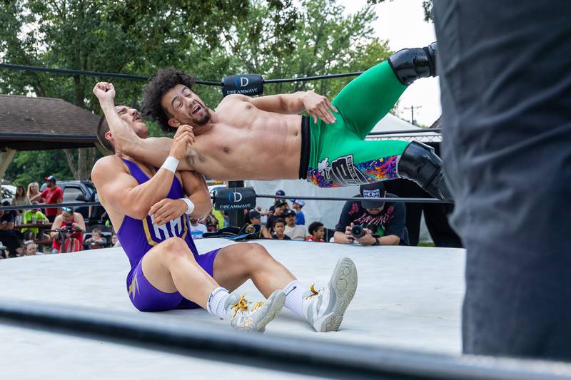 (right) Davey Bang of 'Bang and Matthews' strikes (left) Hunter Holdcraft of 'The Hype' with uppercut at the Taste of the Illinois Valley DreamWave Wrestling event on Saturday, August 2, 2025 at Centennial Park in Peru.