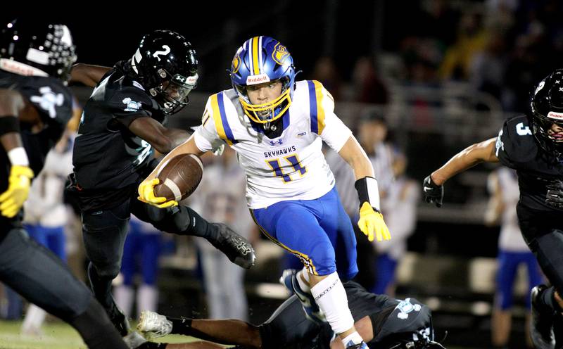 Johnsburg’s Ryan Franze runs the ball in varsity football on Friday Sept. 27, 2024, at Woodstock North High School in Woodstock.