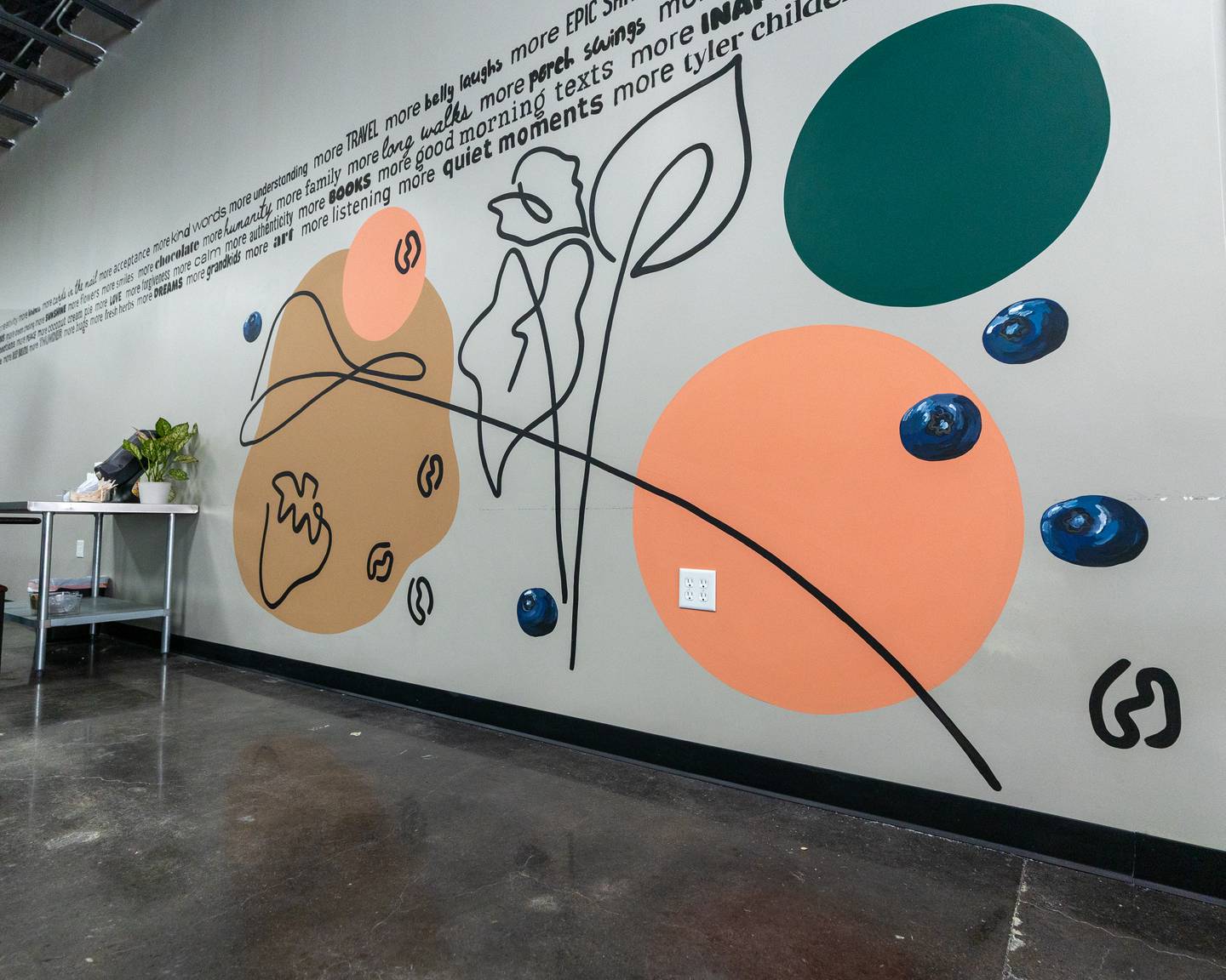 Completed mural painted by Lacey Haltenhof of 'The Laced Brush' is displayed on the Southside wall of More Cafe in Ottawa on Monday, Feb. 2, 2026.