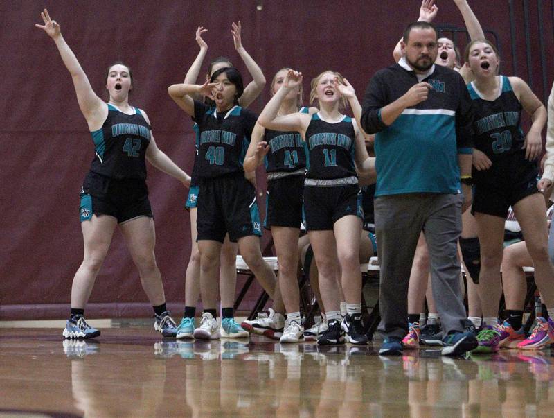 Woodstock North’s Thunder get revved up during a rally in varsity girls basketball at Marengo Tuesday evening.