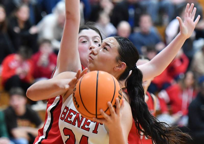 Benet’s Emma Briggs lays the ball up as Marist’s Lily Porter defends during the Montini Christmas Tournament championship game on December 27, 2025 at Montini Catholic High School in Lombard.