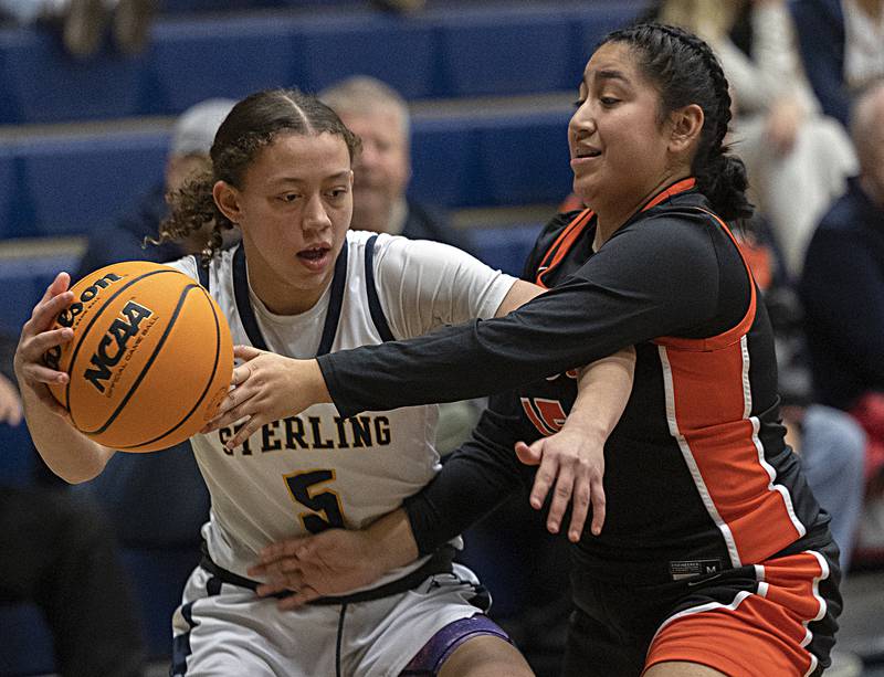 Sterling’s Anessa Johnson works against United Township’s Annika Tristan Thursday, Feb. 6, 2025, at Sterling High School.