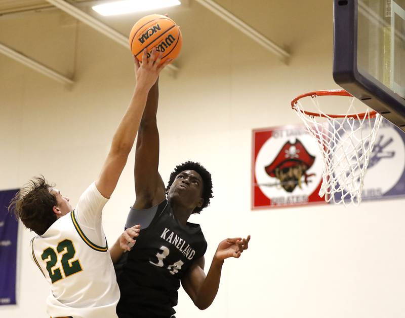 Kaneland's Jeffrey Hassan blocks the shot of Crystal Lake South's Anthony Santarelli during the IHSA Class 3A Rochelle Sectional championship basketball game on Friday, March 7, 2025, at Rochelle High School.