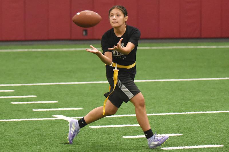 Kankakee's Mikaylah Santoyo catches a pass during flag football practice Wednesday, Aug. 13, 2025.