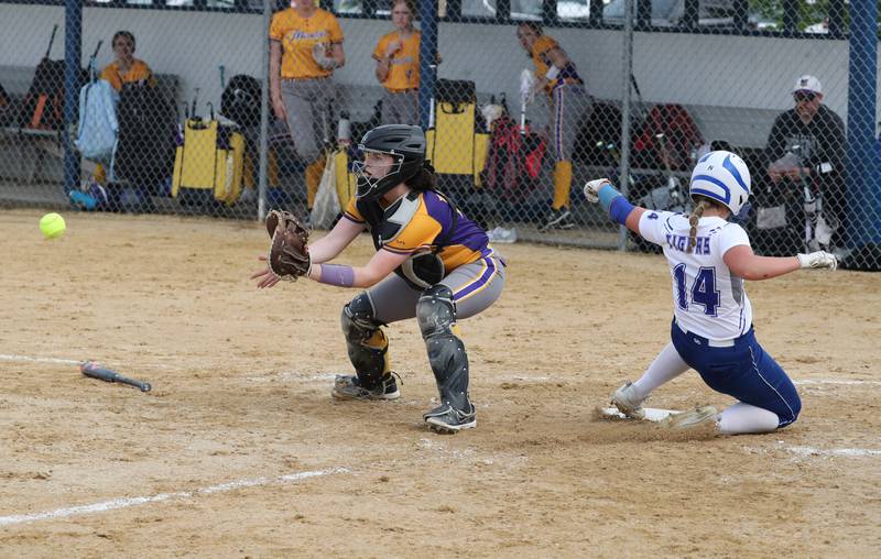 Princeton's Izzy Gibson beats the throw to Mendota catcher Emma Schultz on Monday.