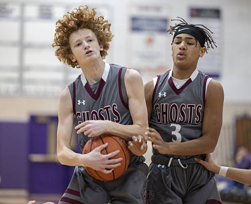 IVC’s Tyler Lauber (left) and Brynden Coventry work to pull down a rebound Tuesday, Dec. 20, 2022 against Dixon.