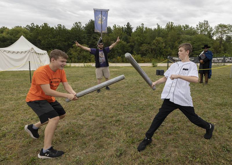 Brayden Schroyer (left), 13, and Reid Bahr, 13, spar with foam swords Saturday, Sept. 20, 2025, at Fall and Fantasy Fest in Dixon. Local live action role players CERLARP sponsored the faux fighting.