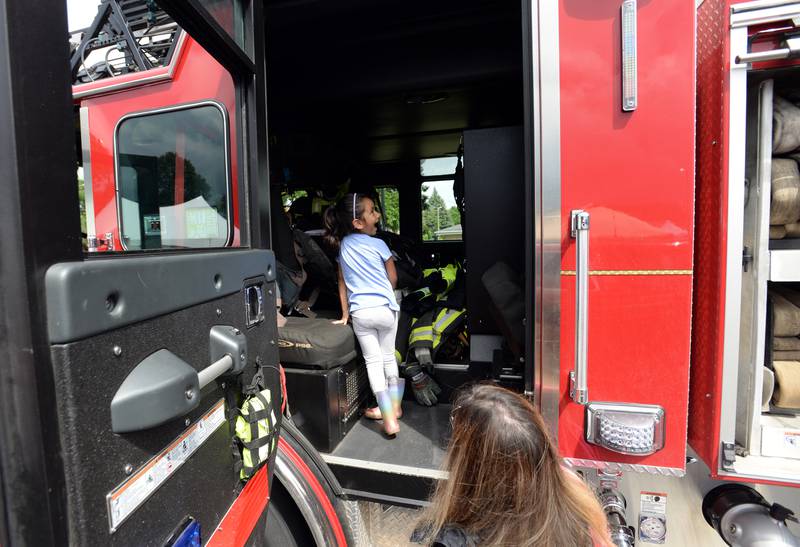 Kindergartner of Ideal School, Emilia Landa  reacts to seeing inside a fire truck while attending District 105 Back to School/Neighborhood Fest held at Ideal Park Saturday Aug 20, 2022.