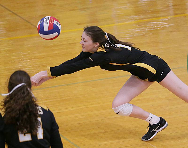 Putnam County's Cate Trovero dives for the ball against Henry in the Tri-County Conference Tournament on Monday, Oct. 10, 2022 in Seneca.