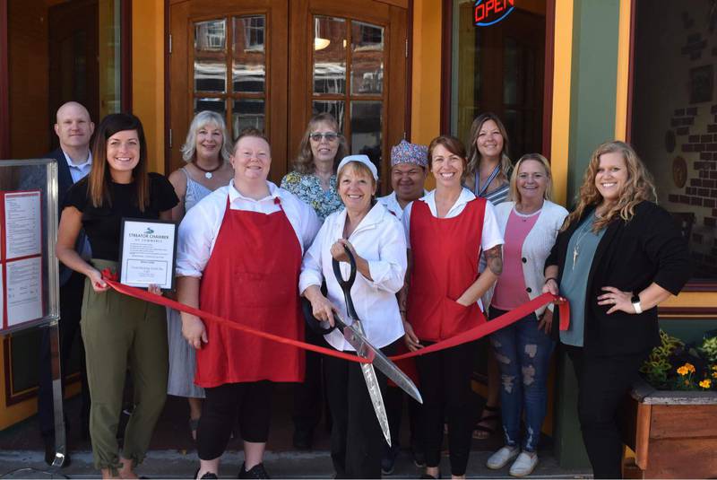 (From left to right) Ben Hiltabrand (chamber board), Courtney Levy (executive director), Karen Karpati (chamber board), Julie Hoskins (employee), Judy Booze (chamber ambassador), Toni Pettit (owner), Gloria (employee), Amanda (employee), Dana Stillwell (chamber board), Cindy Cameron (chamber ambassador) and Megan Wright (chamber member services coordinator) participate in a ribbon cutting Friday, Aug. 12, 2022, at Good Morning Good Day Cafe in Streator.