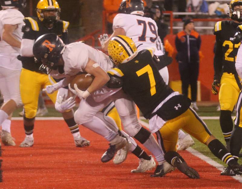 Rochester's Nolan Mrozowski runs in for a touchdown as he is met by St. Laurence's Timmy Allison during the Class 4A State football championship on Friday, Nov, 24, 2023 at Hancock Stadium in Normal.