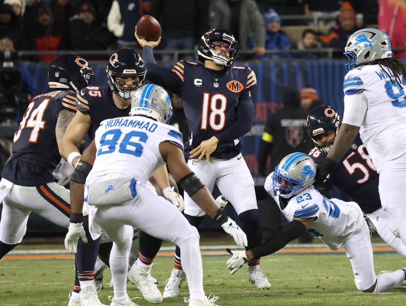 Chicago Bears quarterback Caleb Williams throws as he is hit by Detroit Lions cornerback Rock Ya-Sin during their game Sunday, Jan. 4, 2026, at Soldier Field in Chicago.