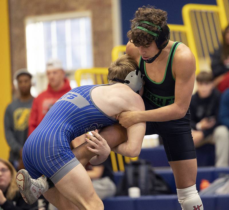 Newman’s Zhyler Hansen the leg of Rock Falls’ Josiah Tarbill in the 126 pound finals Saturday, Dec. 7, 2024, at the Carson DeJarnatt Invitational in Sterling. Tarbill took the win.