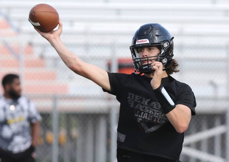 DeKalb quarterback Cole Latimer throws a pass during practice Monday, Aug. 7, 2023, at DeKalb High School.