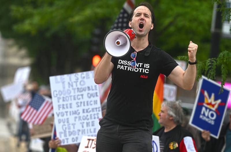 Lewis Wilkins of Elgin leads a chant during the "Good Trouble Lives On" protest in Elgin Thursday.