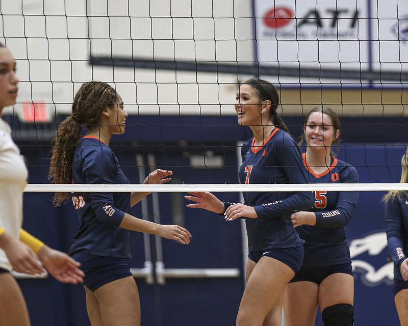 Oswego's Hannah Herrick (7) celebrates a point with teammates during Class 4A Regional Final volleyball match between Neuqua Valley at Oswego. Oct 30, 2025 in Plainfield.