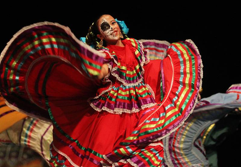 Emma Garcia, 10, of Waukegan performs with the Mexico en La Piel Folkloric Dancers during the Day of the Dead Celebration at the Round Lake Beach Cultural & Civic Center.