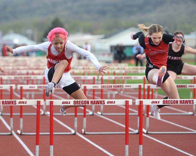 Amboy's Elly Jones (right) races Rockford Auburn's Soloria Jackson to the finish line in the 100 meter hurdles at the Landers-Loomis Girls Invitational in Oregon on Friday, April 21.