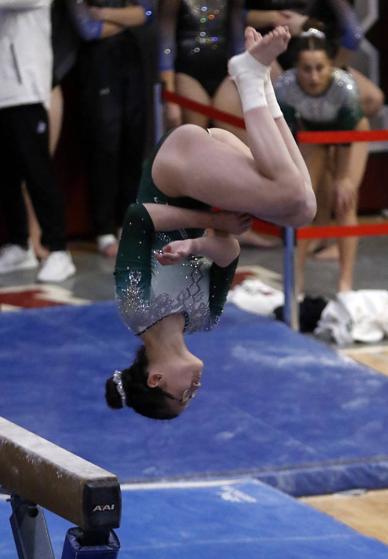 Glenbard West's Skylar Oh competes in the preliminary round of the balance beam Friday, Feb. 17, 2023, during the IHSA Girls State Final Gymnastics Meet at Palatine High School.