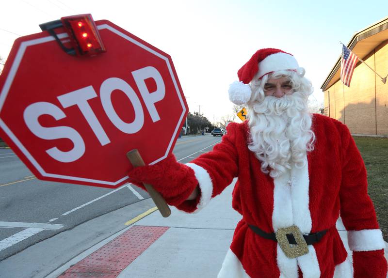 Santa Claus came to Lincoln Junior High School to be the crossing guard for the day and spread holiday cheer to the students on Wednesday, Dec. 20, 2023 in La Salle.