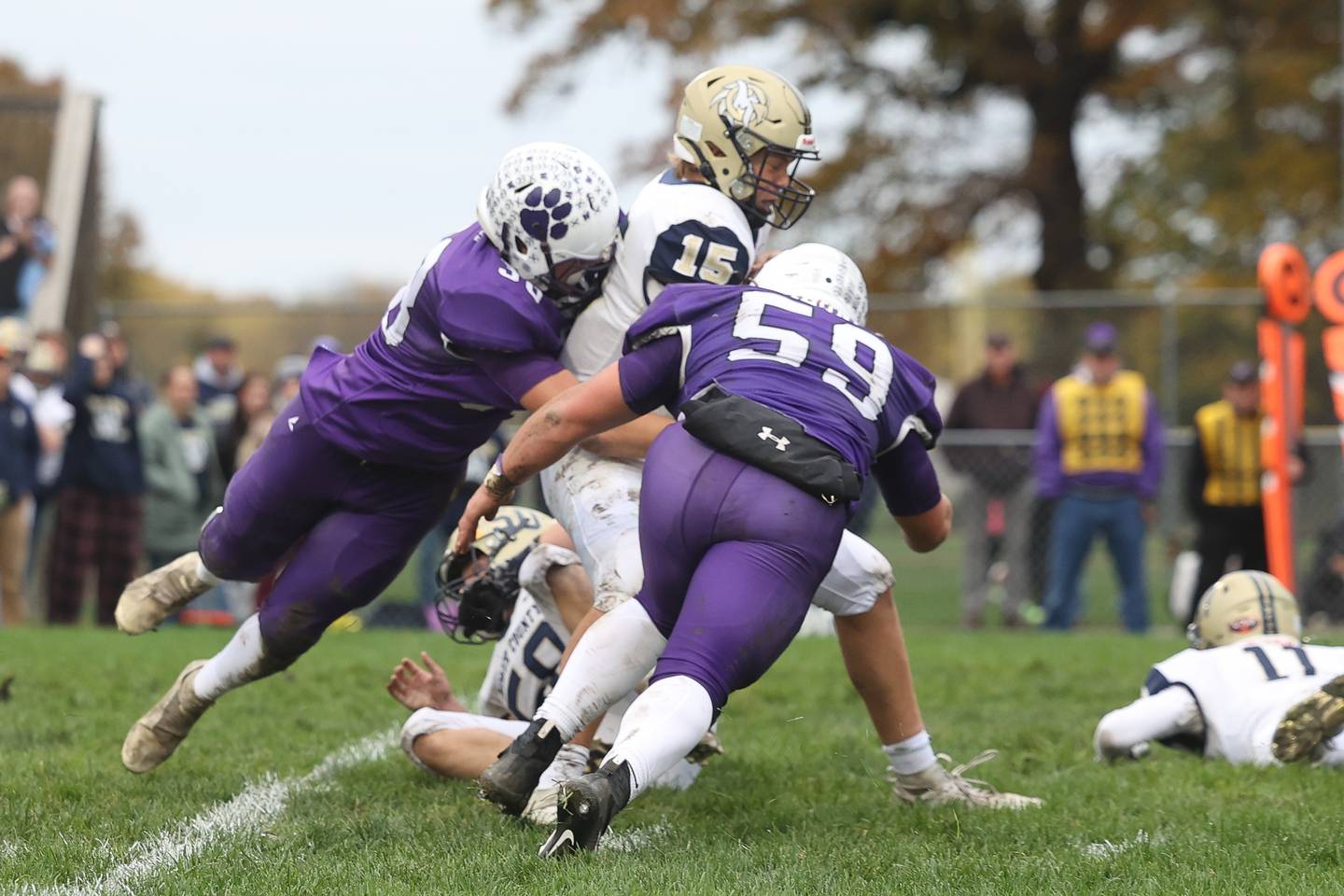 Wilmington’s defense gets to Mercer County’s Colby Cox for a sack in round 1 of the Class 2A playoffs on Saturday, Oct. 28, 2023 in Wilmington.