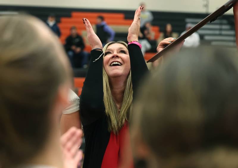 Huntley head coach Karen Naymola looks to the heavens Monday, Nov. 11, 2024, while celebrating their Class 4A supersectional win over Fremd at DeKalb High School.