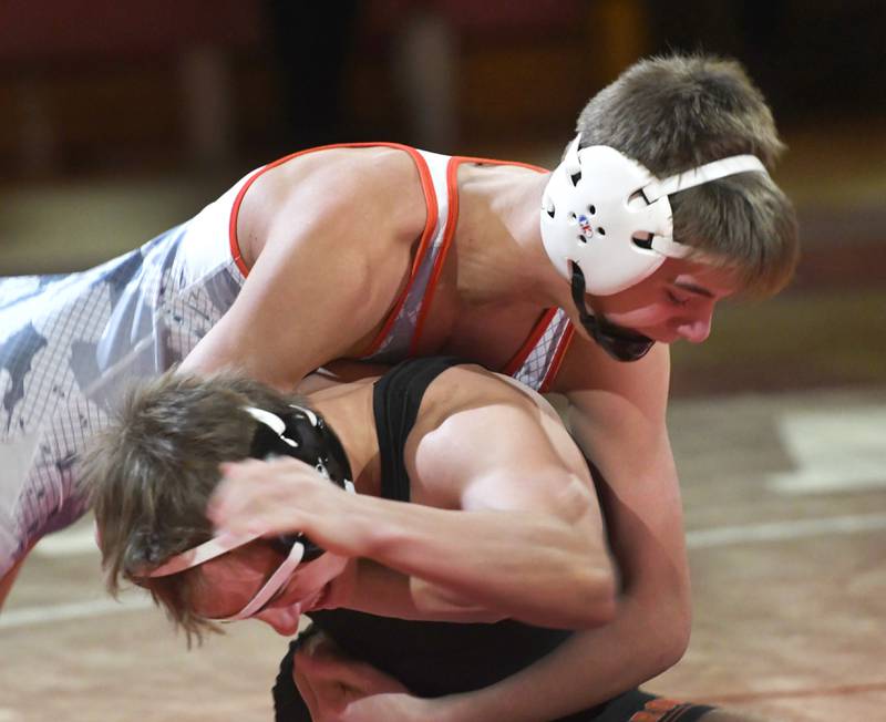 Oregon's Jack Benesh (top) wrestles Byron's  Hunter King at 132 pounds at the Oregon Quad meet on Saturday, Jan. 17, 2026 at the Blackhawk Center in Oregon.