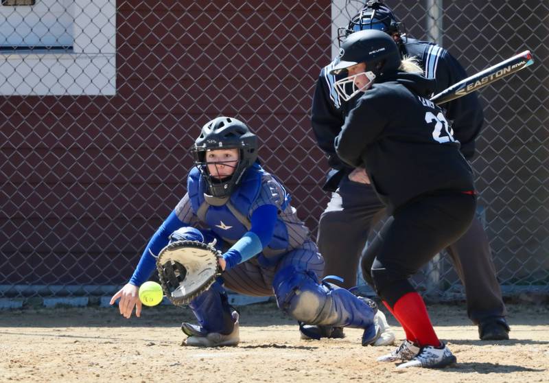 Princeton catcher Izzy Gibson watches the ball into the mitt with Hall's Jayde Lewis at the plate Saturday at Hall.