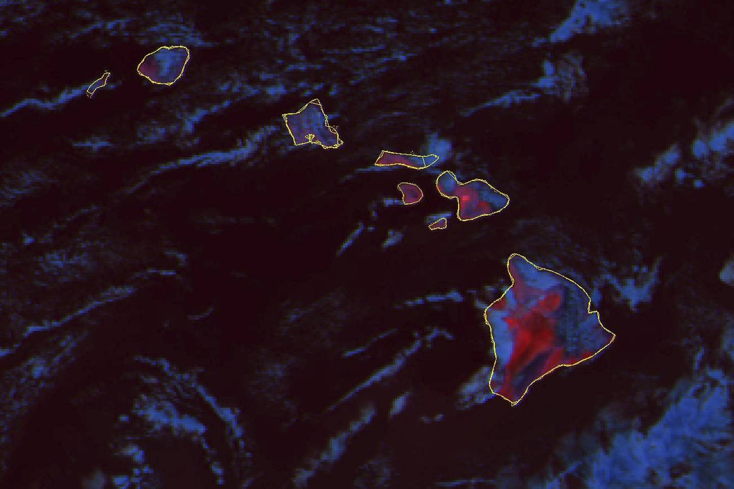This GOES-18  fire temperature composite satellite image taken 6:30 p.m. EDT. on Wednesday, Aug. 9, 2023 and released by NOAA, shows hot land surface temperatures in red on the Hawaii Islands. A dangerous mix of conditions appear to have combined to make the wildfires blazing a path of destruction in Hawaii particularly damaging, including high winds, low humidity and dry vegetation.