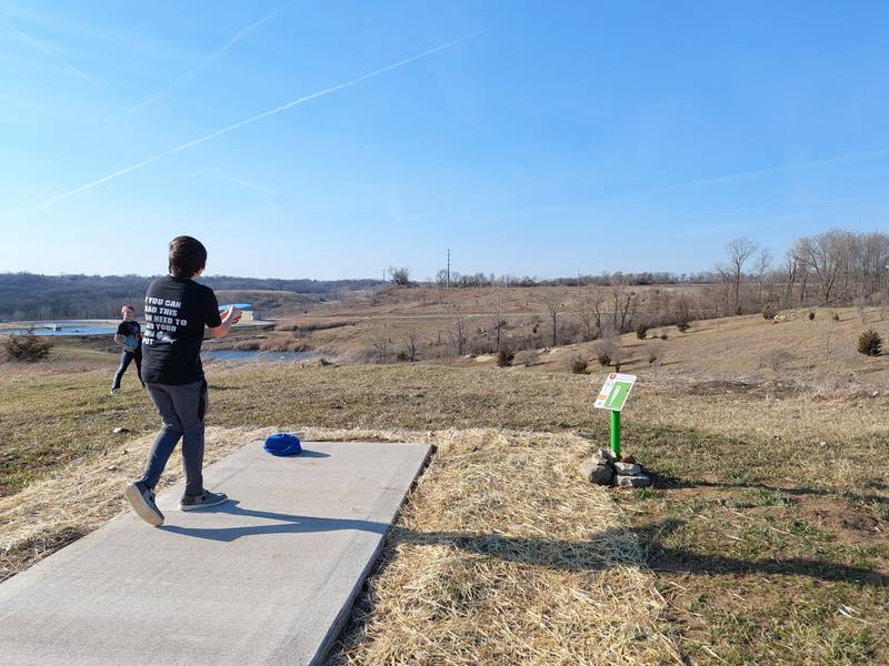 Eli Washkowiak fires his disc from the tee box Sunday, March 3, 2024, at the new disc golf course at Rotary Park in La Salle.