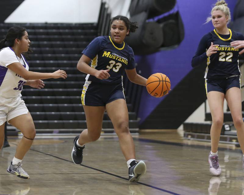 Yorkville Christian's Kiana Ogulei (33) races down the court with the ball during their basketball game between Yorkville Christian at Plano Wednesday, Jan 07, 2026 in Plano.