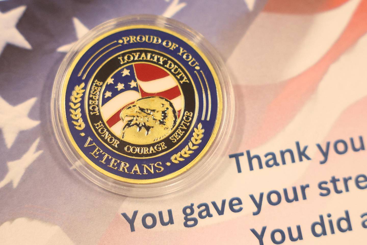 Skip Hoechbauer, veteran of the US Army, presents a coin along with the veteran pin to let them know they are not forgotten on Wednesday, August 14, 2024 in Joliet.