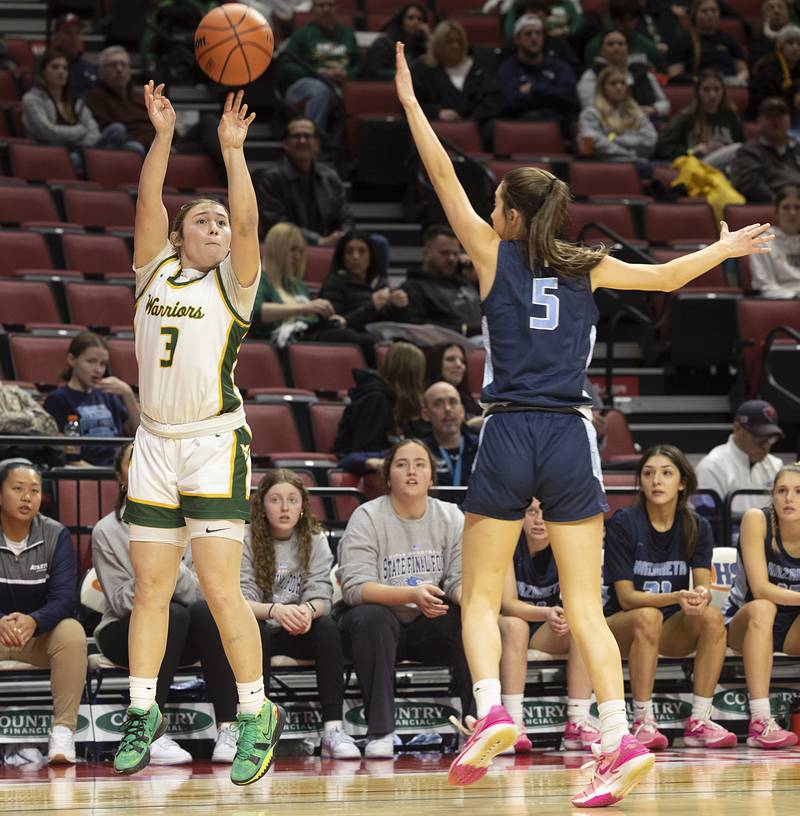 Waubonsie Valley’s Maya Cobb puts up a three-point shot against Nazareth Academy’s Sophia Towne Friday, March 1, 2024 in the girls basketball 4A state semifinal at CEFCU Arena in Normal.