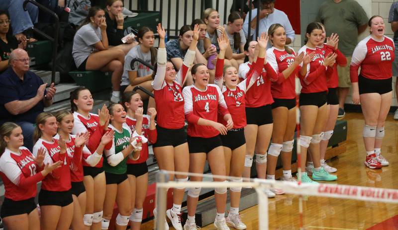 Members of the L-P volleyball team cheer on the Lady Cavs as they play Sycamore on Tuesday, Sept. 23, 2025 in Sellett Gymnasium at L-P High School.
