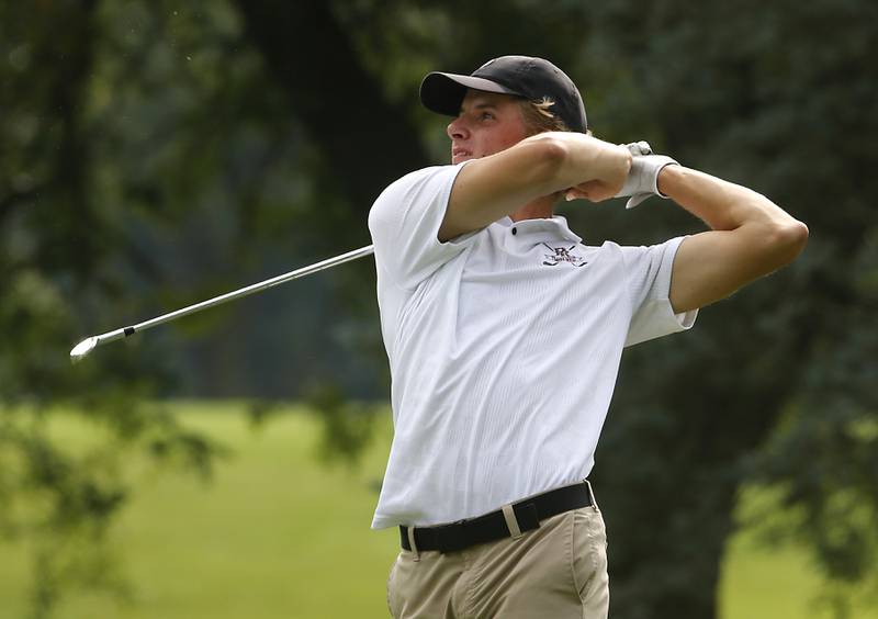 Prairie Ridge’s Charlie Pettrone watches his tee shot on the eighth hole during the Fox Valley Conference Boys Golf Tournament Thursday, Sept. 21, 2023, at McHenry Country Club in McHenry.