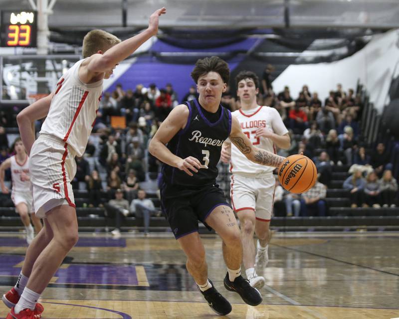 Plano's Ethan Taxis (3) drives past the defense of Streator's Joe Hoekstra (25) during their Plano Christmas Classic basketball game between Streator at Plano Friday, Dec 26, 2025 in Plano.