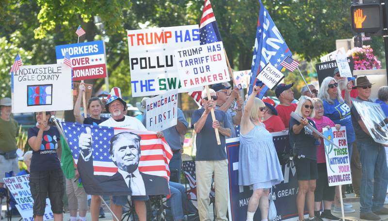 Demonstrators both for and against President Donald Trump and his policies hold signs and flags at the "Workers Over Billionaires" rally in downtown Oregon on Monday, Sept. 1, 2025.