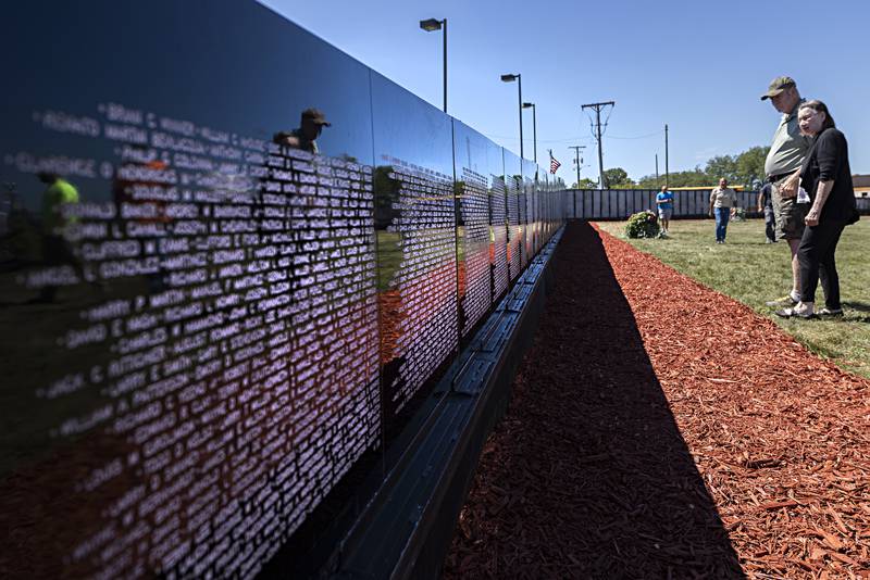 Ron and Bernice Gerdts of Clinton, Iowa check out the Vietnam Traveling Memorial Wall Thursday, August 31, 2023.