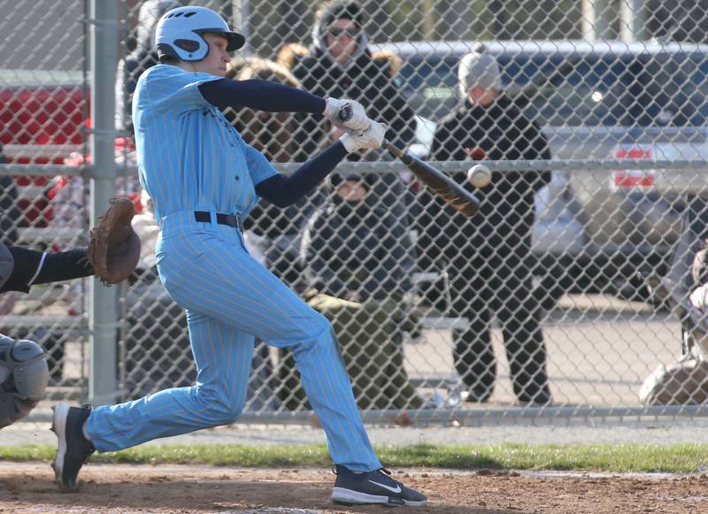 Marquette's Charlie Mullen makes contact with the ball against Woodland/Flanagan-Cornell on Wednesday March 27, 2024 in Ottawa.